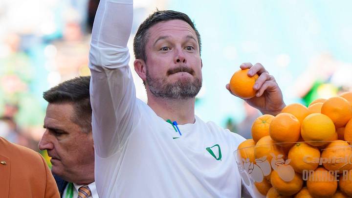 Oregon head coach Dan Lanning, left, throws out oranges as the team celebrates its win as the Oregon Ducks take on the Texas Tech Red Raiders in the Orange Bowl on Jan. 1, 2026, at Hard Rock Stadium in Miami, Florida.