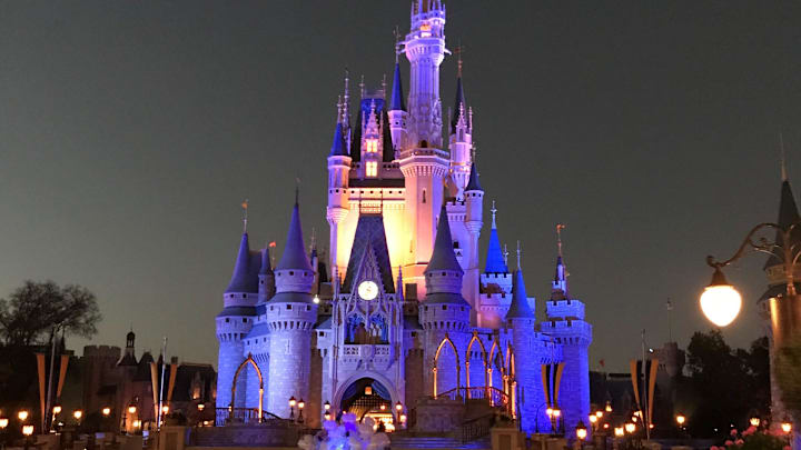 A crowd gathers in front of the Cinderella Castle at Walt Disney World's Magic Kingdom in Orlando in