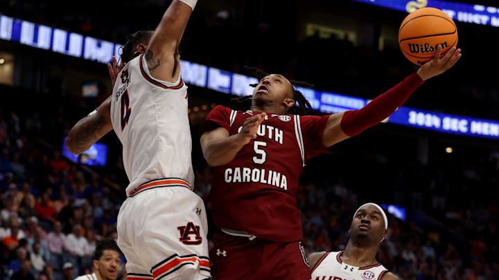 South Carolina Gamecocks guard Meechie Johnson (5) attempts a basket while being guarded by Auburn. 