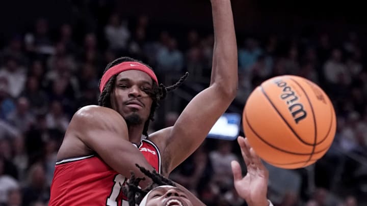 Mar 23, 2024; Salt Lake City, UT, USA; Dayton Flyers forward DaRon Holmes II (15) blocks Arizona Wildcats guard Caleb Love (2) during the second half in the second round of the 2024 NCAA Tournament at Vivint Smart Home Arena-Delta Center. Mandatory Credit: Gabriel Mayberry-USA TODAY Sports