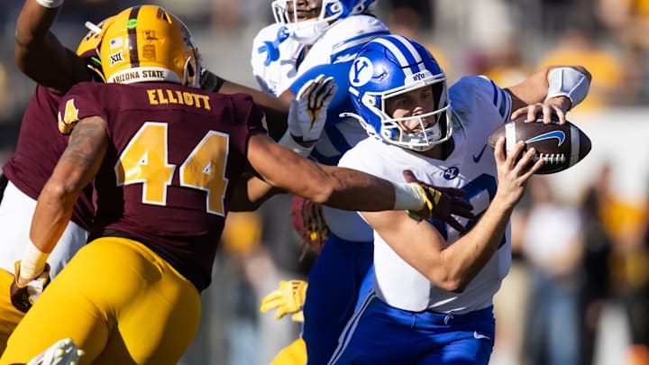 Brigham Young Cougars quarterback Jake Retzlaff (12) threw two interceptions in BYU's 28-23 loss to Arizona State on Nov. 23. Brigham Young Cougars quarterback Jake Retzlaff (12) threw two interceptions in BYU's 28-23 loss to Arizona State on Nov. 23.