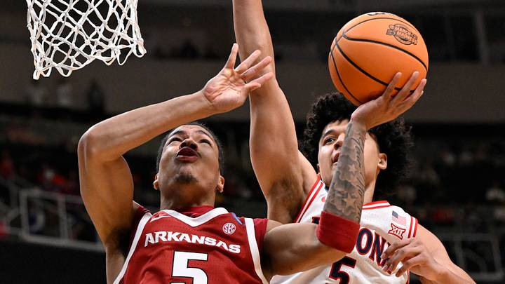 Mar 26, 2026; San Jose, CA, USA; Arkansas Razorbacks guard Darius Acuff Jr. (5) shoots past Arizona Wildcats guard Brayden Burries (5) in the second half during a Sweet Sixteen game of the West Regional of the men's 2026 NCAA Tournament at SAP Center. Mandatory Credit: Eakin Howard-Imagn Images Mar 26, 2026; San Jose, CA, USA; Arkansas Razorbacks guard Darius Acuff Jr. (5) shoots past Arizona Wildcats guard Brayden Burries (5) in the second half during a Sweet Sixteen game of the West Regional of the men's 2026 NCAA Tournament at SAP Center. Mandatory Credit: Eakin Howard-Imagn Images