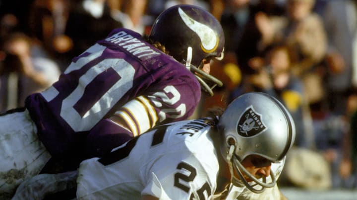 South Carolina football legend Bobby Bryant tackling Hall of Famer Fred Biletnikoff in Super Bowl XI