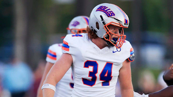 Bolles' Asher Ghioto eyes the quarterback Aug. 30 at Trinity Christian Academy.