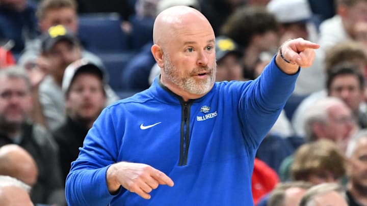 Mar 19, 2026; Buffalo, NY, USA; Saint Louis Billikens head coach Josh Schertz instructs his team against the Georgia Bulldogs during the first half of a first round game of the men's 2026 NCAA Tournament at Keybank Center. Mandatory Credit: Mark Konezny-Imagn Images