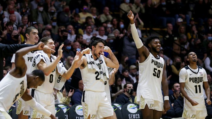 The Purdue bench celebrates a basket during the second half of an NCAA men's basketball game