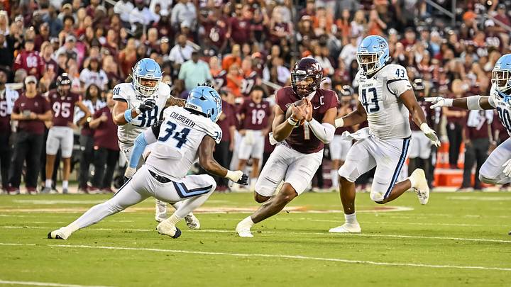 Sep 13, 2025; Blacksburg, Virginia, USA; Virginia Tech Hokies quarterback Kyron Drones (1) runs the ball as Old Dominion Monarchs linebacker Jahleel Culbreath (34) and defensive end Kris Trinidad (43) pursue during the first quarter at Lane Stadium. Mandatory Credit: Brian Bishop-Imagn Images Sep 13, 2025; Blacksburg, Virginia, USA; Virginia Tech Hokies quarterback Kyron Drones (1) runs the ball as Old Dominion Monarchs linebacker Jahleel Culbreath (34) and defensive end Kris Trinidad (43) pursue during the first quarter at Lane Stadium. Mandatory Credit: Brian Bishop-Imagn Images