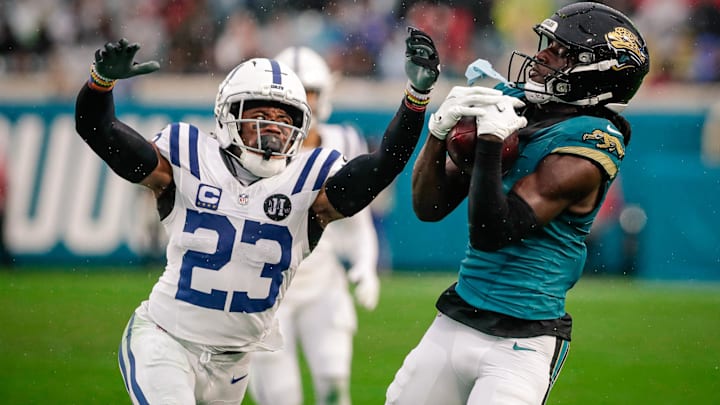 Dec 7, 2025; Jacksonville, Florida, USA;Jacksonville Jaguars wide receiver Brian Thomas Jr. (7) catches a pass over Indianapolis Colts cornerback Kenny Moore II (23) at EverBank Stadium. Mandatory Credit: Travis Register-Imagn Images