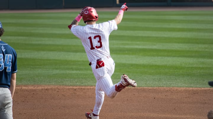 Alabama infielder Luke Vaughn points to the student section to celebrate his home run in the second game of the series against Rhode Island on Feb. 21