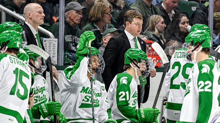 Michigan State's head coach Adam Nightingale, center, looks on during the third period in the game against Notre Dame on Thursday, Feb. 19, 2026, at the Munn Ice Arena in East Lansing.