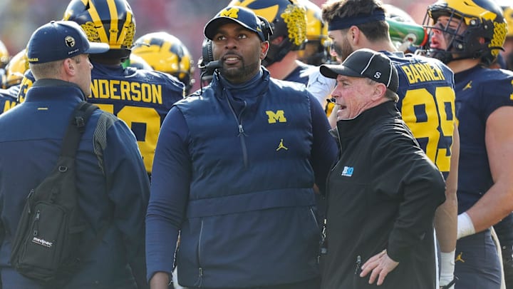 Michigan acting head coach Sherrone Moore watches a replay during the first half against Ohio State