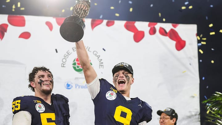 Michigan quarterback J.J. McCarthy lifts the Rose Bowl trophy