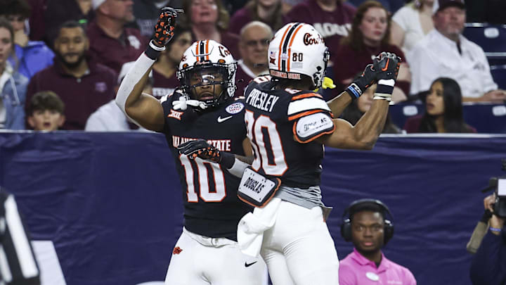 Dec 27, 2023; Houston, TX, USA; Oklahoma State Cowboys wide receiver Rashod Owens (10) celebrates with wide receiver Brennan Presley (80) after scoring a touchdown during the first quarter against the Texas A&M Aggies at NRG Stadium. Mandatory Credit: Troy Taormina-Imagn Images