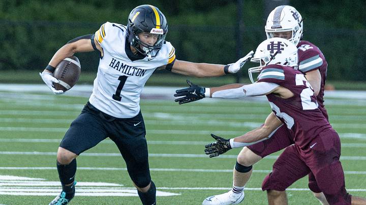 Hamilton's Garner Hulst stiff-arms a Holland Christian defender on Friday, Sept. 11 Hamilton's Garner Hulst stiff-arms a Holland Christian defender on Friday, Sept. 11