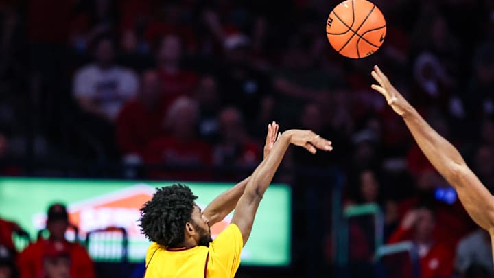 Jan 14, 2026; Tucson, Arizona, USA; Arizona State Sun Devils guard Moe Odum (5) shoots a three point shot over Arizona Wildcats guard Dwayne Aristode (2) during the second half of the game at McKale Memorial Center. Mandatory Credit: Aryanna Frank-Imagn Images Jan 14, 2026; Tucson, Arizona, USA; Arizona State Sun Devils guard Moe Odum (5) shoots a three point shot over Arizona Wildcats guard Dwayne Aristode (2) during the second half of the game at McKale Memorial Center. Mandatory Credit: Aryanna Frank-Imagn Images