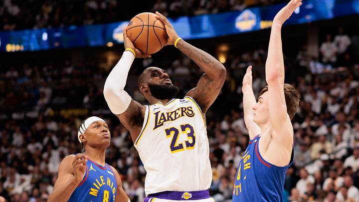 Apr 20, 2024; Denver, Colorado, USA; Los Angeles Lakers forward LeBron James (23) shoots the ball against Denver Nuggets forward Peyton Watson (8) and guard Christian Braun (0) during the fourth quarter in game one of the first round for the 2024 NBA playoffs at Ball Arena. Apr 20, 2024; Denver, Colorado, USA; Los Angeles Lakers forward LeBron James (23) shoots the ball against Denver Nuggets forward Peyton Watson (8) and guard Christian Braun (0) during the fourth quarter in game one of the first round for the 2024 NBA playoffs at Ball Arena.