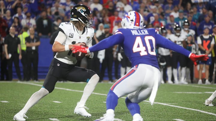 Bills Von Miller heads toward Jaguars quarterback Trevor Lawrence during second half action at Highmark Stadium
