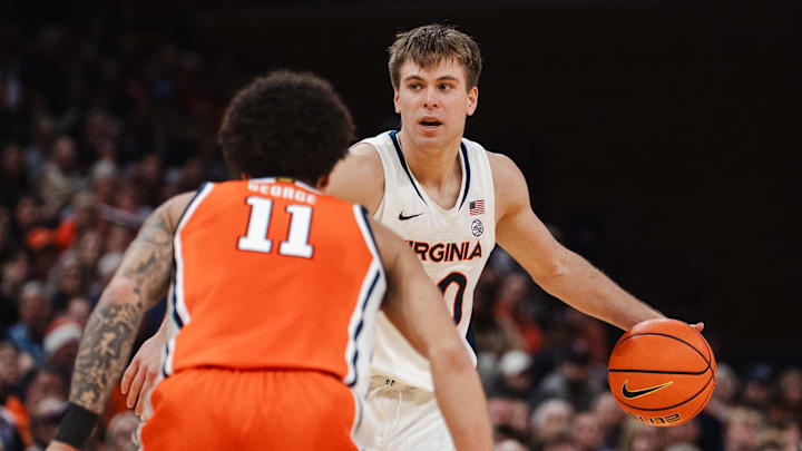 Feb 7, 2026; Charlottesville, Virginia, USA; Virginia Cavaliers guard Dallin Hall (30) controls the ball while Syracuse Orange guard Naithan George (11) defends during the second half at John Paul Jones Arena. Mandatory Credit: Emily Faith Morgan-Imagn Images