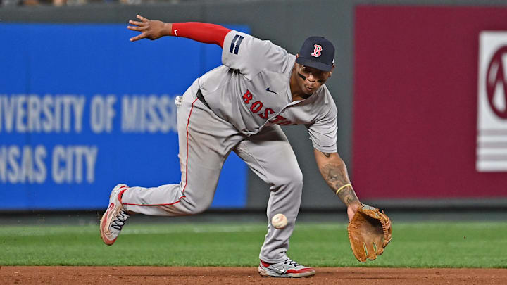 Kansas City, Missouri, USA; Boston Red Sox third baseman Rafael Devers (11) fields a ground ball in the eighth inning against the Kansas City Royals at Kauffman Stadium. Kansas City, Missouri, USA; Boston Red Sox third baseman Rafael Devers (11) fields a ground ball in the eighth inning against the Kansas City Royals at Kauffman Stadium.