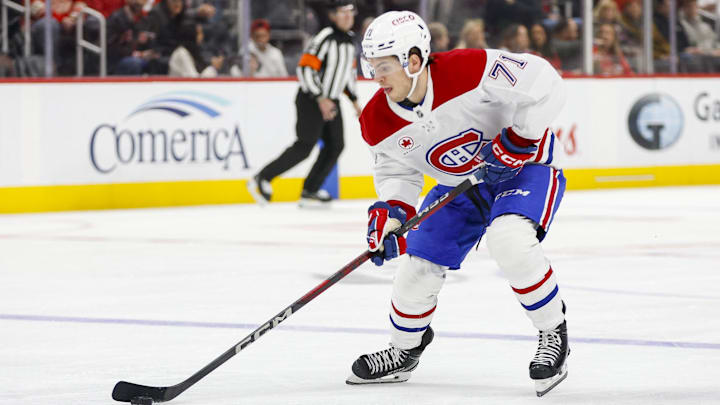 Dec 20, 2024; Detroit, Michigan, USA; Montreal Canadiens center Jake Evans (71) handles the puck during the first period against the Detroit Red Wings at Little Caesars Arena. Mandatory Credit: Brian Bradshaw Sevald-Imagn Images