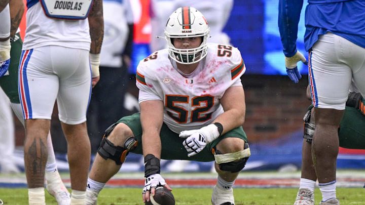 Nov 1, 2025; Dallas, Texas, USA;  Miami Hurricanes offensive lineman James Brockermeyer (52) gets into position during the game between the Mustangs and the Hurricanes at Gerald J. Ford Stadium. Mandatory Credit: Jerome Miron-Imagn Images