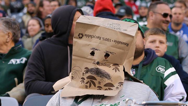 Nov 25, 2018; East Rutherford, NJ, USA; A fan of the New York Jets wears a bag over his head during the fourth quarter against the New England Patriots at MetLife Stadium. Nov 25, 2018; East Rutherford, NJ, USA; A fan of the New York Jets wears a bag over his head during the fourth quarter against the New England Patriots at MetLife Stadium.
