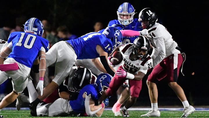 Ballard attempts to get free from the grasp of Oldham County during the first half of their game, Friday, Oct. 17 2025 in Buckner Ky. Ballard attempts to get free from the grasp of Oldham County during the first half of their game, Friday, Oct. 17 2025 in Buckner Ky.