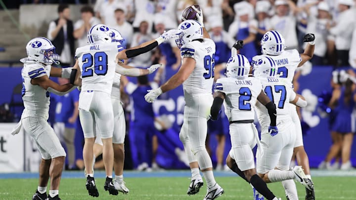Sep 21, 2024; Provo, Utah, USA; Brigham Young Cougars defensive end Tyler Batty (92) celebrates an interception against the Kansas State Wildcats during the second quarter at LaVell Edwards Stadium. Mandatory Credit: Rob Gray-Imagn Images