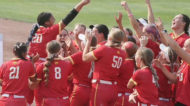 Carlisle softball team celebrates after winning over Dallas Center-Grimes' during the first inning in the class 4A state softball quarterfinal at Rogers Sports complex on Monday, July 22, 2024, in Fort Dodge, Iowa.