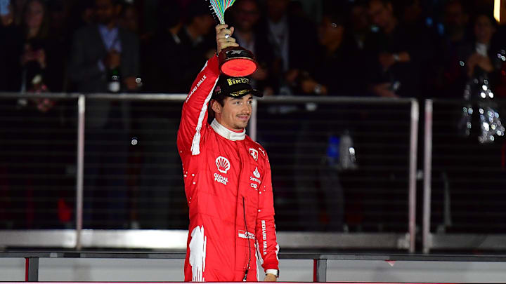 Nov 18, 2023; Las Vegas, Nevada, USA; Scuderia Ferrari driver Charles LeClerc of Monaco (16) celebrates after placing second in the Las Vegas Grand Prix at Las Vegas Strip Circuit. Mandatory Credit: Gary A. Vasquez-USA TODAY Sports