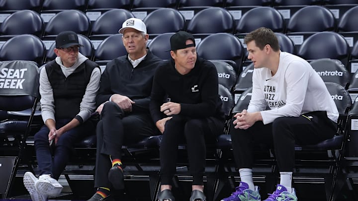 Feb 6, 2024; Salt Lake City, Utah, USA; From left to right, Utah Jazz general manager Justin Zanik, CEO Danny Ainge, owner Ryan Smith and head coach Will Hardy sit court side before the game between the Utah Jazz and the Oklahoma City Thunder at Delta Center. Mandatory Credit: Rob Gray-Imagn Images