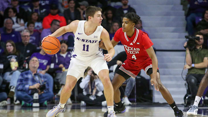 Jan 14, 2025; Manhattan, Kansas, USA; Kansas State Wildcats guard Brendan Hausen (11) is guarded by Texas Tech Red Raiders guard Christian Anderson (4) during the second half at Bramlage Coliseum. Mandatory Credit: Scott Sewell-Imagn Images