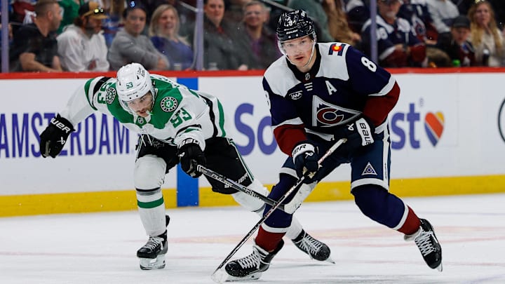 Mar 18, 2026; Denver, Colorado, USA; Colorado Avalanche defenseman Cale Makar (8) controls the puck ahead of Dallas Stars center Wyatt Johnston (53) in overtime at Ball Arena. Mandatory Credit: Isaiah J. Downing-Imagn Images