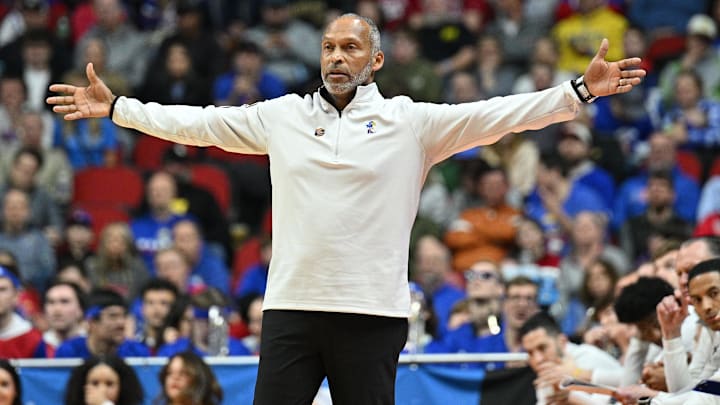 Mar 18, 2023; Des Moines, IA, USA; Kansas Jayhawks acting head coach Norm Roberts reacts during the first half against the Arkansas Razorbacks at Wells Fargo Arena. Mandatory Credit: Jeffrey Becker-Imagn Images Mar 18, 2023; Des Moines, IA, USA; Kansas Jayhawks acting head coach Norm Roberts reacts during the first half against the Arkansas Razorbacks at Wells Fargo Arena. Mandatory Credit: Jeffrey Becker-Imagn Images