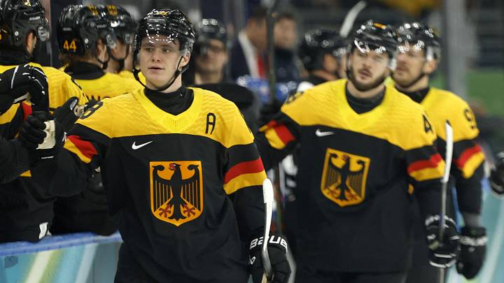 Feb 15, 2026; Milan, Italy;  Tim Stutzle of Germany celebrates scoring their first goal with teammates  against the United States in men's ice hockey group C play during the Milano Cortina 2026 Olympic Winter Games at Milano Santagiulia Ice Hockey Arena. Mandatory Credit: Geoff Burke-Imagn Images