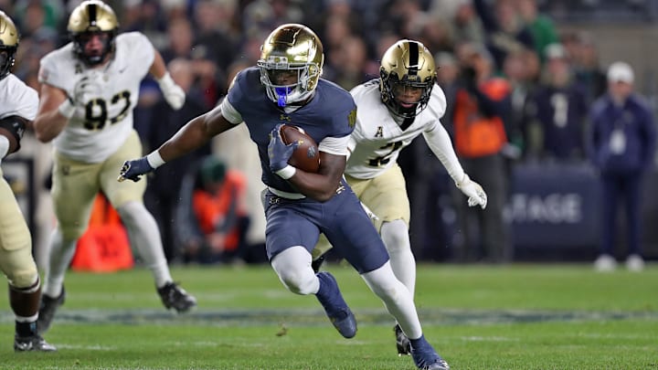Nov 23, 2024; New York, New York, USA; Notre Dame Fighting Irish running back Jeremiyah Love (4) runs the ball against the Army Black Knights during the first half at Yankee Stadium. Mandatory Credit: Danny Wild-Imagn Images Nov 23, 2024; New York, New York, USA; Notre Dame Fighting Irish running back Jeremiyah Love (4) runs the ball against the Army Black Knights during the first half at Yankee Stadium. Mandatory Credit: Danny Wild-Imagn Images