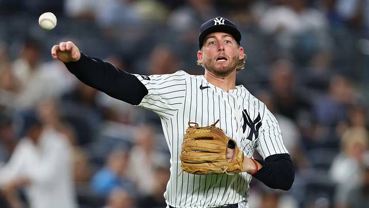 Sep 9, 2026; Bronx, New York, USA;  New York Yankees third baseman Ryan McMahon (19) throws the ball to first base for an out during the seventh inning against the Colorado Rockies at Yankee Stadium.  Mandatory Credit: Vincent Carchietta-Imagn Images
