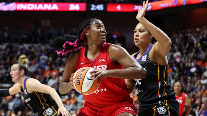Sep 25, 2024; Uncasville, Connecticut, USA; Indiana Fever forward Aliyah Boston (7) drives to the basket during the first half against the Connecticut Sun during game two of the first round of the 2024 WNBA Playoffs at Mohegan Sun Arena. 