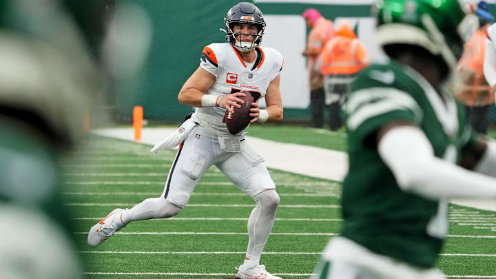 Sep 29, 2024; East Rutherford, New Jersey, USA;  Denver Broncos quarterback Bo Nix (10) looks for a receiver against the New York Jets during the second half at MetLife Stadium. Mandatory Credit: Robert Deutsch-Imagn Images
