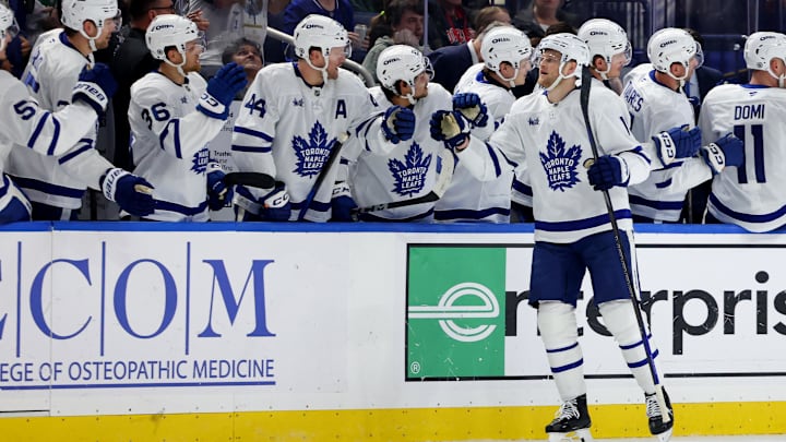 Apr 15, 2025; Buffalo, New York, USA;  Toronto Maple Leafs center Steven Lorentz (18) celebrates his goal with teammates during the second period against the Buffalo Sabres at KeyBank Center. Mandatory Credit: Timothy T. Ludwig-Imagn Images