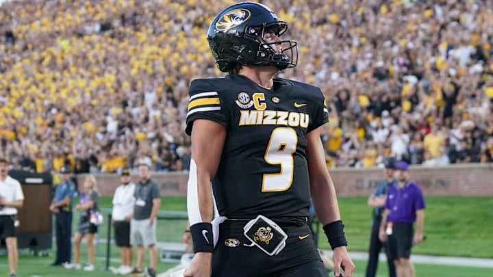 Aug 28, 2025; Columbia, Missouri, USA; Missouri Tigers quarterback Beau Pribula (9) celebrates after scoring against the Central Arkansas Bears during the first half of the game at Faurot Field at Memorial Stadium. Mandatory Credit: Denny Medley-Imagn Images