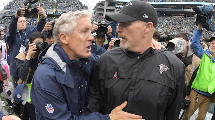 Oct 16, 2016; Seattle, WA, USA; Seattle Seahawks coach Pete Carroll (left) shakes hands with Atlanta