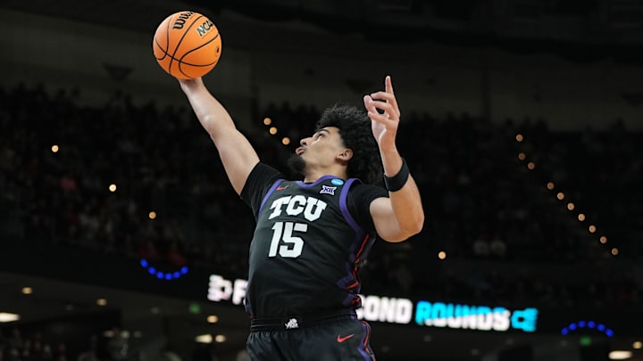 Mar 19, 2026; Greenville, SC, USA; Texas Christian University Horned Frogs forward David Punch (15) grabs a rebound against the Ohio State Buckeyes in the second half during a first round game of the men's 2026 NCAA Tournament at Bon Secours Wellness Arena. Mandatory Credit: Bob Donnan-Imagn Images