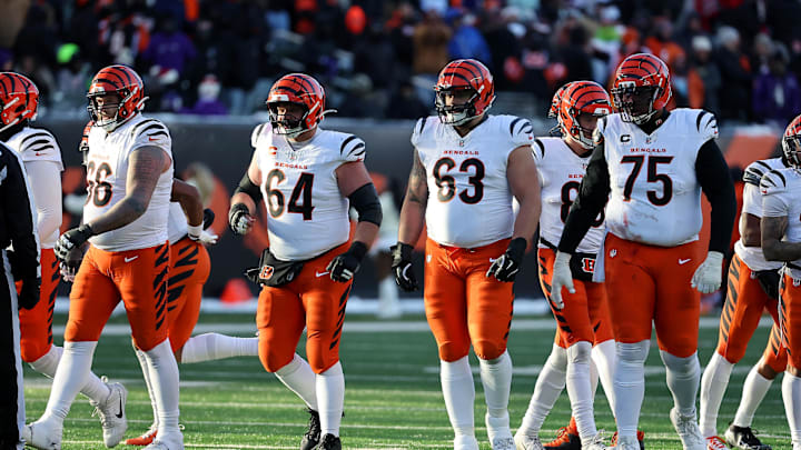 Dec 14, 2025; Cincinnati, Ohio, USA; Cincinnati Bengals center Ted Karras (64) and guard Dylan Fairchild (63) and offensive tackle Orlando Brown (75) line up for a play during the fourth quarter against the Baltimore Ravens at Paycor Stadium. Mandatory Credit: Joseph Maiorana-Imagn Images Dec 14, 2025; Cincinnati, Ohio, USA; Cincinnati Bengals center Ted Karras (64) and guard Dylan Fairchild (63) and offensive tackle Orlando Brown (75) line up for a play during the fourth quarter against the Baltimore Ravens at Paycor Stadium. Mandatory Credit: Joseph Maiorana-Imagn Images