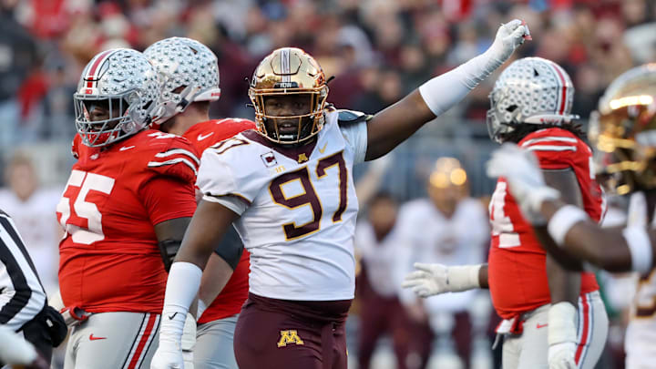 Nov 18, 2023; Columbus, Ohio, USA;  Minnesota Golden Gophers defensive lineman Jalen Logan-Redding (97) celebrates a third down stop during the first quarter against the Ohio State Buckeyes at Ohio Stadium. Mandatory Credit: Joseph Maiorana-Imagn Images