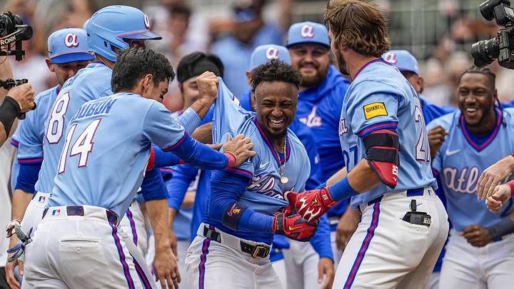 Jun 20, 2026; Cumberland, Georgia, USA; Atlanta Braves players react with second baseman Ozzie Albies (1) after he hit a two run walk off home run against the Milwaukee Brewers during the ninth inning at Truist Park. Mandatory Credit: Dale Zanine-Imagn Images