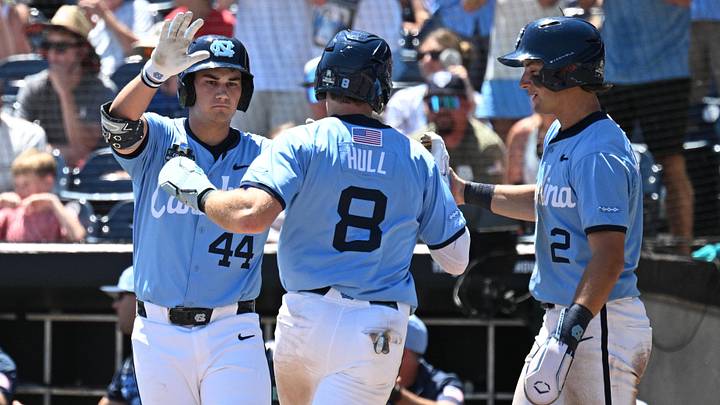 Jun 17, 2026; Omaha, NE, USA; North Carolina Tar Heels center fielder Owen Hull (8) scores as first baseman Erik Paulsen (44) and shortstop Jake Schaffner (2) at Charles Schwab Field. Mandatory Credit: Steven Branscombe-Imagn Images Jun 17, 2026; Omaha, NE, USA; North Carolina Tar Heels center fielder Owen Hull (8) scores as first baseman Erik Paulsen (44) and shortstop Jake Schaffner (2) at Charles Schwab Field. Mandatory Credit: Steven Branscombe-Imagn Images