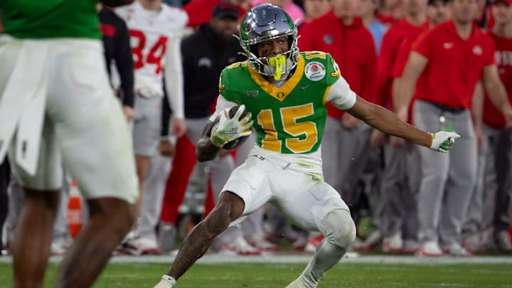 Oregon wide receiver Tez Johnson carries the ball as the Oregon Ducks face the Ohio State Buckeyes Wednesday, Jan. 1, 2025, in the quarterfinal of the College Football Playoff at the Rose Bowl in Pasadena, Calif. Oregon wide receiver Tez Johnson carries the ball as the Oregon Ducks face the Ohio State Buckeyes Wednesday, Jan. 1, 2025, in the quarterfinal of the College Football Playoff at the Rose Bowl in Pasadena, Calif.