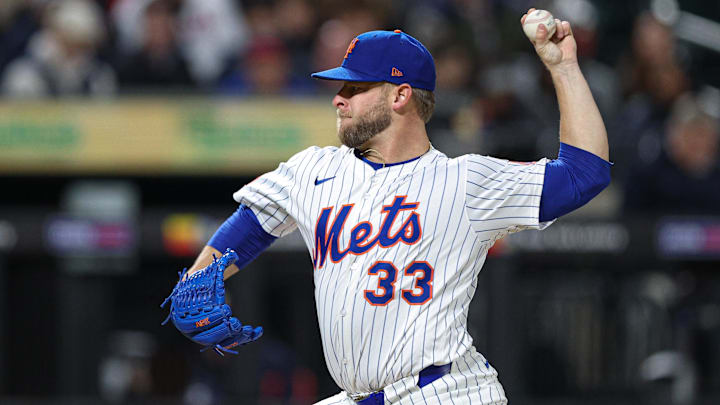 Apr 17, 2025; New York City, New York, USA; New York Mets relief pitcher A.J. Minter (33) delivers a pitch during the eighth inning against the St. Louis Cardinals at Citi Field. Mandatory Credit: Vincent Carchietta-Imagn Images