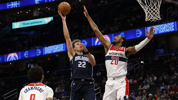 Orlando Magic forward Franz Wagner (22) shoots the ball as Washington Wizards forward Alex Sarr (20) defends in the first half at Capital One Arena.